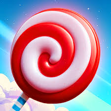 Sweet Peaks gameplay showing candy block tower building with chocolate chip blocks and floating coins